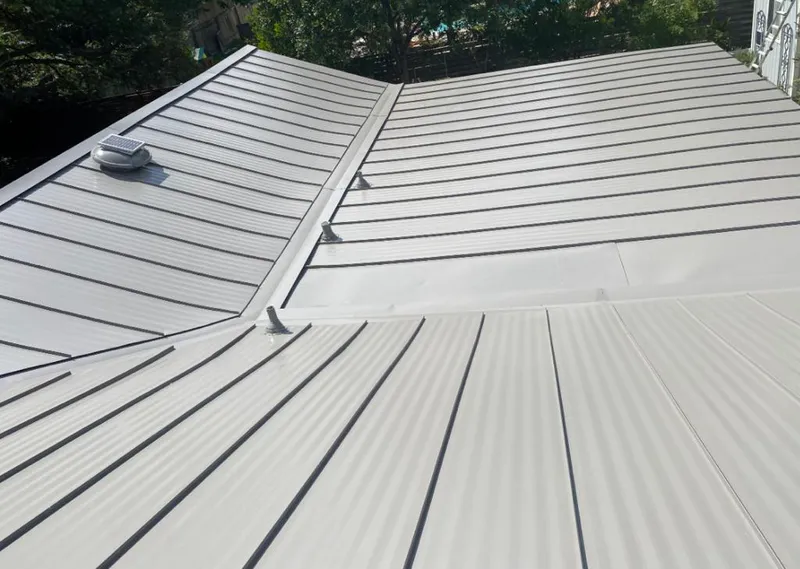 Solar attic fan installed on a metal roof for Roof Ventilation in Reno